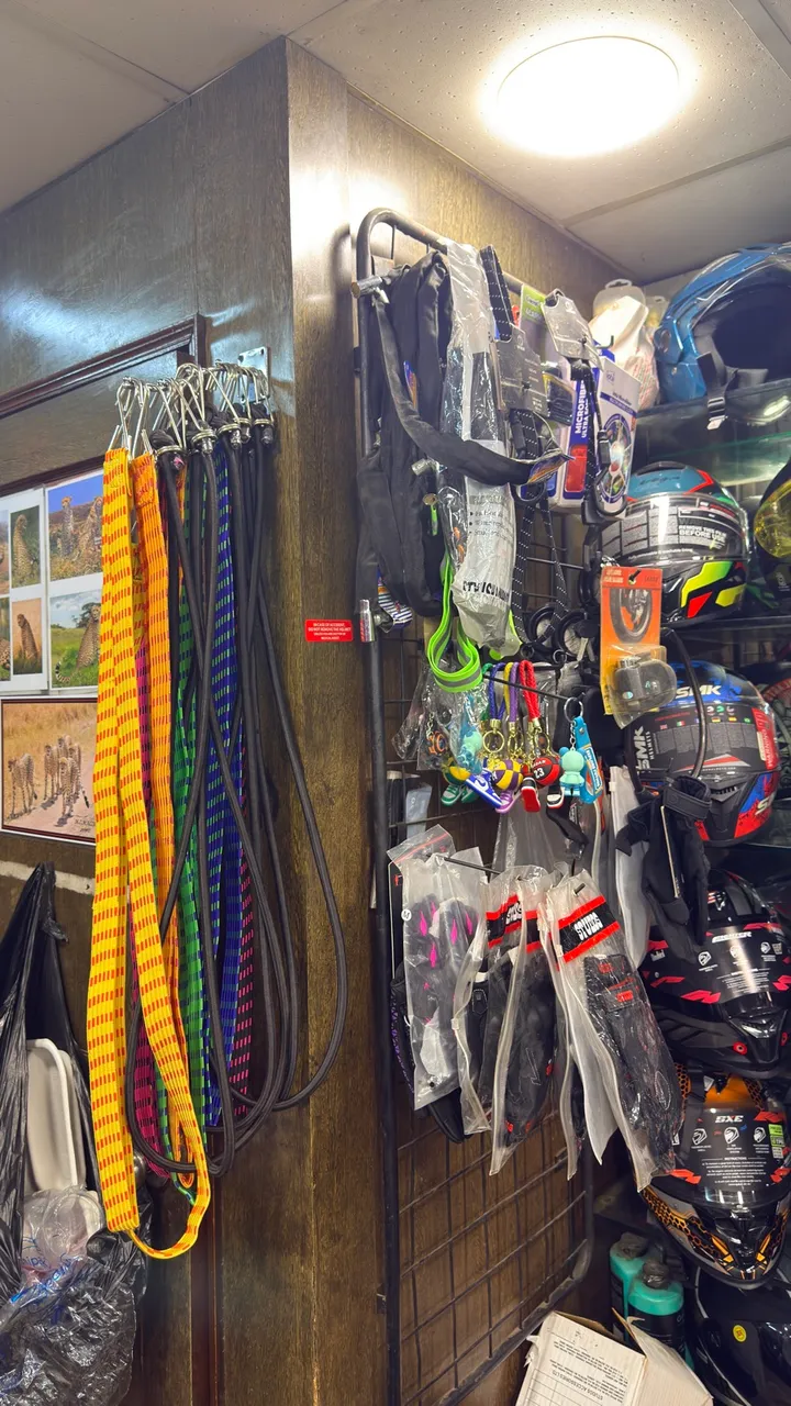 Riding accessories and gloves wall at Speed World