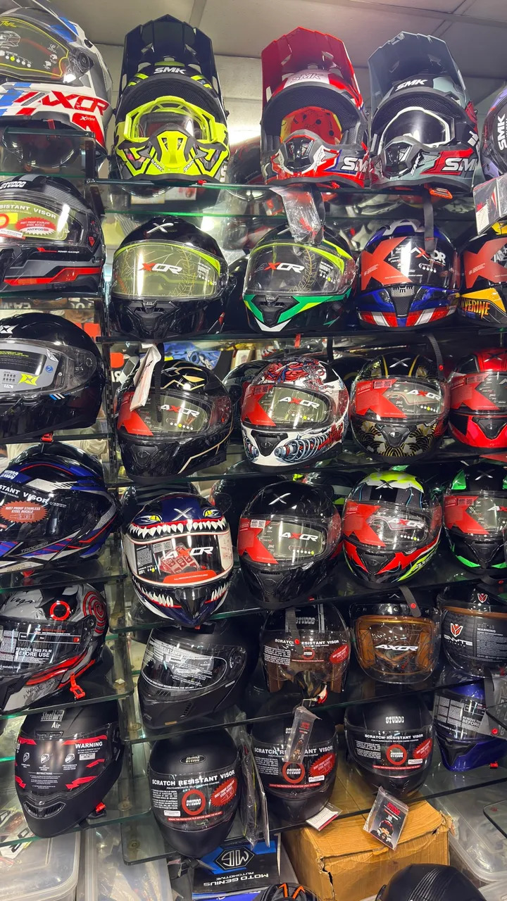 Shelves of full-face helmets from Axor and SMK at Speed World