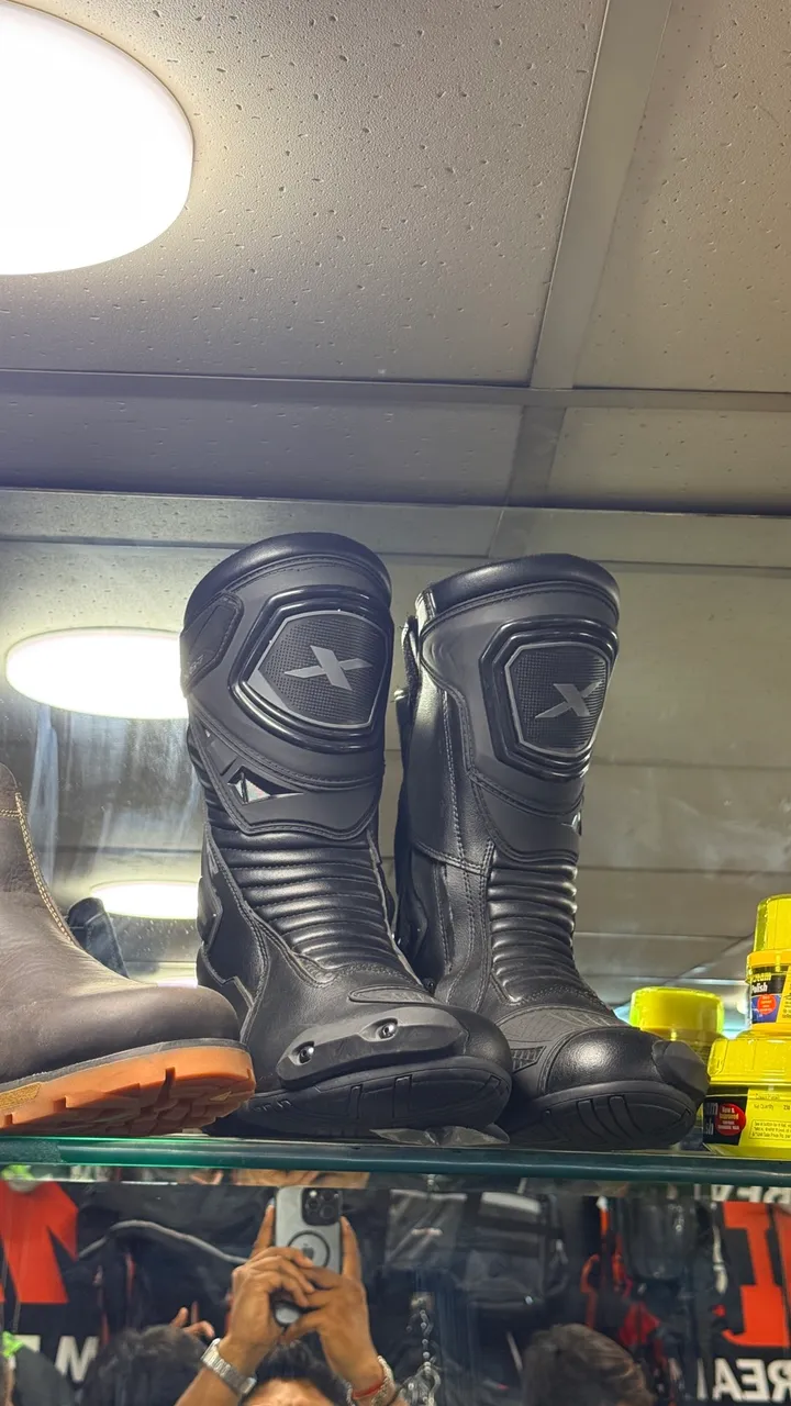 Axor riding boots on the shelf at Speed World