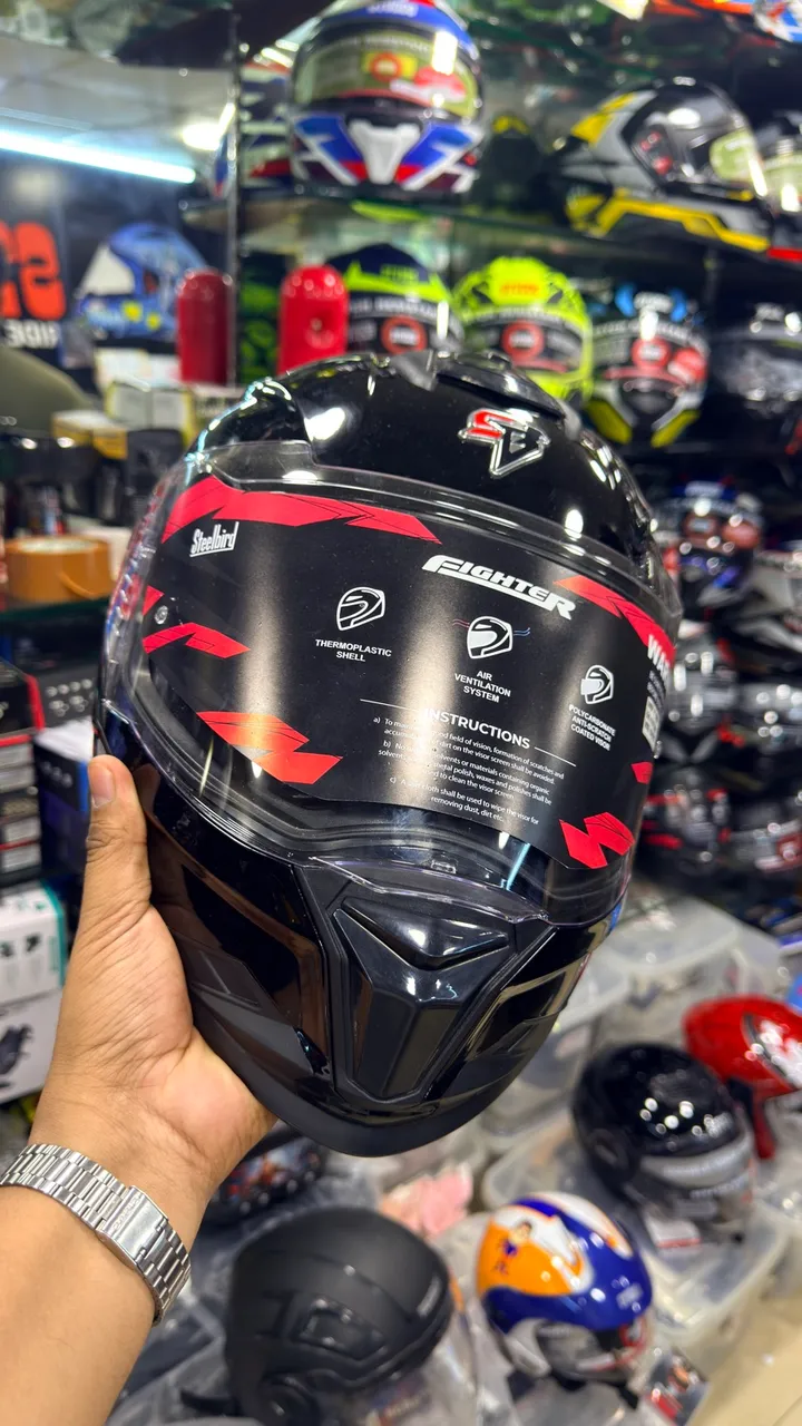 Steelbird full-face helmet held up inside Speed World