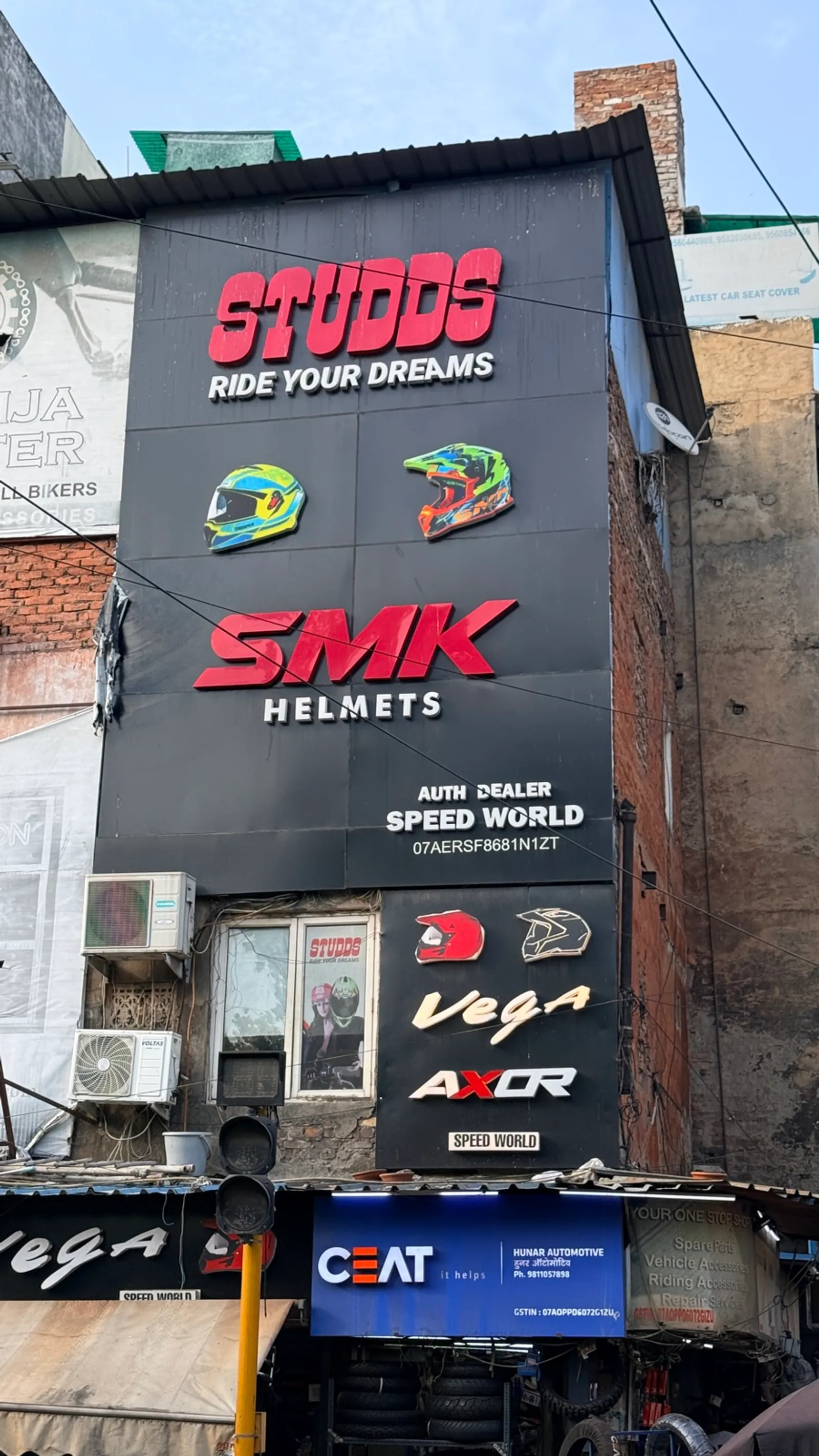 Speed World storefront with large Studds and SMK Helmets signage